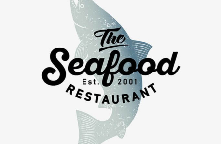 Logo na tle ryby restauracji The Seafood istniejącej od 2001r.